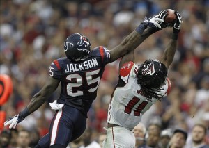 uspw_5772958_KareemJackson_JulioJones_NFL Dec 4, 2011; Houston, TX, USA; Former Crimson Tiders Clash: Atlanta Falcons wide receiver Julio Jones (11) catches a pass over Houston Texans cornerback Kareem Jackson (25) in the fourth quarter at Reliant Stadium. The Texans defeated the Falcons 17-10. Photo Credit: Brett Davis-US PRESSWIRE