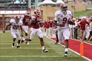 Amari Cooper TD vs Ark 2012 Sep 15, 2012; Fayetteville, AR, USA; Alabama Crimson Tide wide receiver Amari Cooper (9) runs after a catch for a touchdown against the Arkansas Razorbacks during the second quarter at Donald W. Reynolds Razorback Stadium. Mandatory Credit: Nelson Chenault-US PRESSWIRE