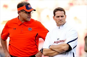 Malzahn - Chizik 2011 Happier Times: Oct 8, 2011; Fayetteville, AR, USA; Auburn Tigers offensive coordinator Gus Malzahn and head coach Gene Chizik talks prior to the game against the Arkansas Razorbacks at Donald W. Reynolds Razorback Stadium. (Nelson Chenault-USA TODAY Sports)