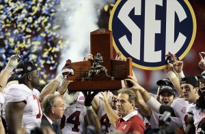 Dec 1, 2012; Atlanta, GA, USA; Alabama Crimson Tide head coach Nick Saban and his team hold the SEC trophy after winning the 2012 SEC Championship game against the Georgia Bulldogs at the Georgia Dome. Alabama won 32-28. (Daniel Shirey-USA TODAY Sports)