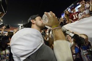 AJ McCarron kisses the BCS National Championship Trophy (Photo Credit: Eileen Blass) AJ McCarron kisses the BCS National Championship Trophy (Photo Credit: Eileen Blass)