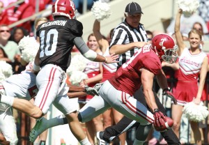 Apr 20, 2013; Tuscaloosa, AL, USA; Alabama Crimson Tide Red Team defensive back Vinnie Sunseri (3) scores a touchdown on an interception by a pass thrown by White Team quarterback AJ McCarron (10) during the annual A-Day game at Bryant Denny Stadium. Mandatory Credit: Marvin Gentry-USA TODAY Sports