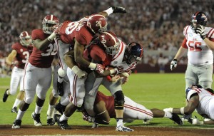 Sep 28, 2013; Tuscaloosa, AL, USA; Mississippi Rebels quarterback Bo Wallace (14) is sacked in the end zone for a safety by Alabama Crimson Tide linebacker C.J. Mosley (32) , defensive lineman Jeoffrey Pagan (8) , defensive lineman Brandon Ivory (99) , defensive back Jarrick Williams (20) and linebacker Denzel Devall (30) during the fourth quarter at Bryant-Denny Stadium. The Alabama Crimson Tide defeated the Mississippi Rebels 25-0. PhotoCredit: John David Mercer-USA TODAY Sports