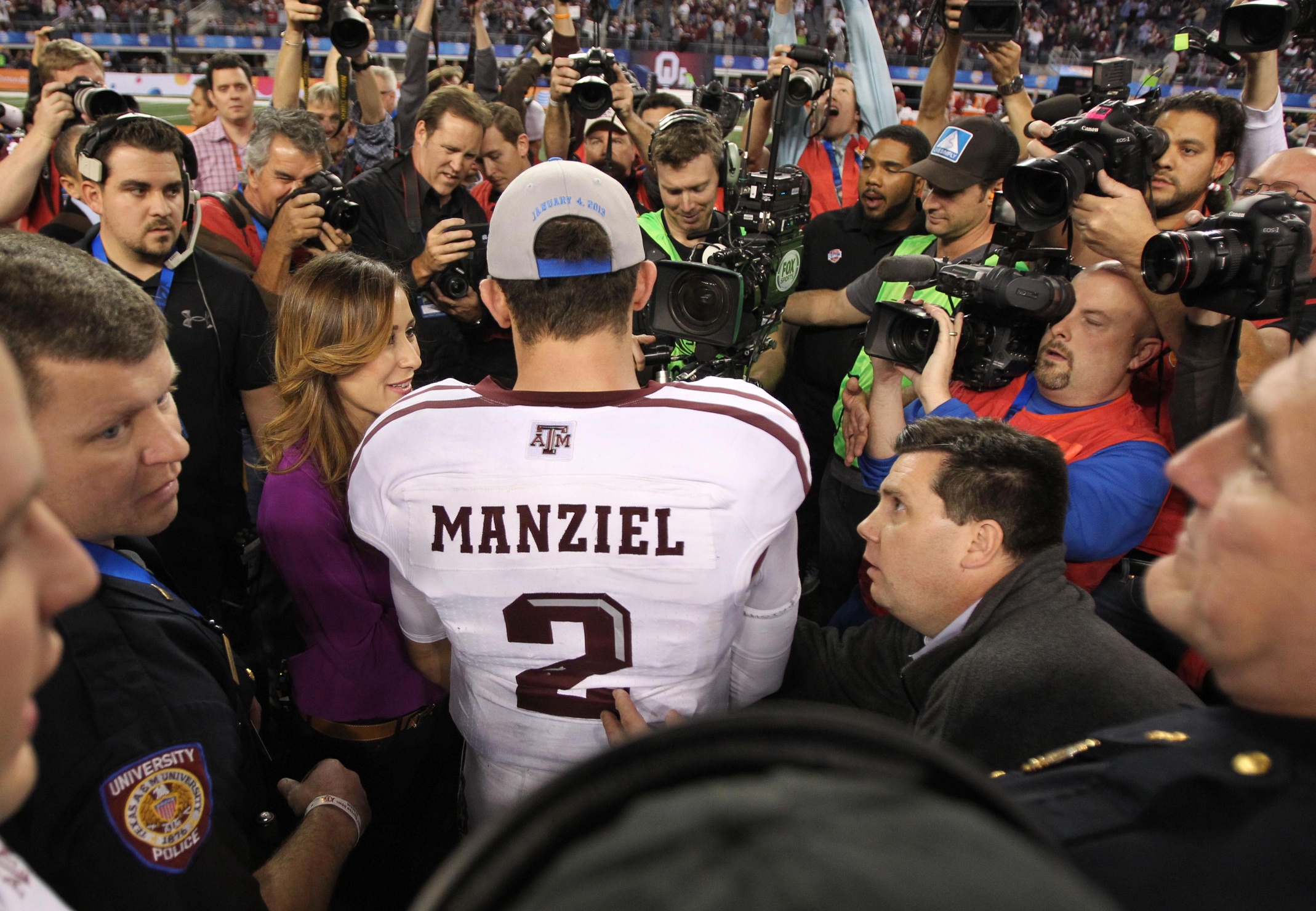 Texas A&M Aggies quarterback Johnny Manziel (2) talks to the media after the game against the Oklahoma Sooners during the Cotton Bowl at Cowboys Stadium. Texas A&M beat Oklahoma 41-13. Mandatory Credit: Tim Heitman-USA TODAY Sports