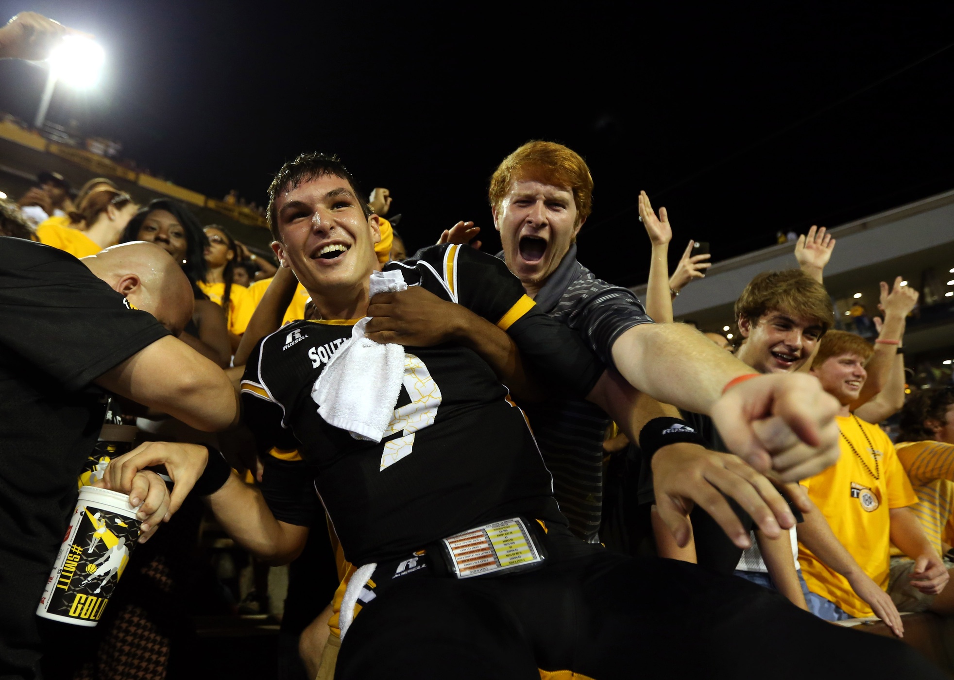 Sep 6, 2014; Hattiesburg, MS, USA; Southern Miss Golden Eagles quarterback Nick Mullens (9) celebrates with fans after their 26-20 win over the Alcorn State Braves at M.M. Roberts Stadium. Mandatory Credit: Chuck Cook-USA TODAY Sports