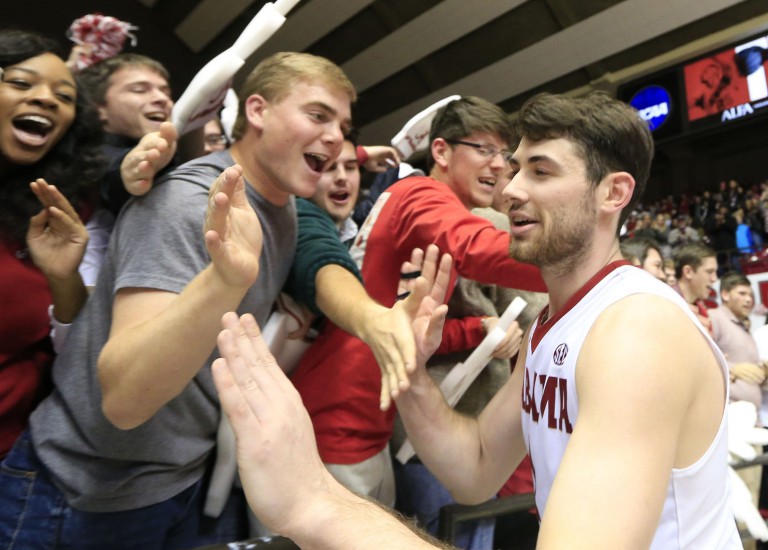 Jan 13, 2016; Tuscaloosa, AL, USA; Alabama Crimson Tide forward Riley Norris (1) celebrates with students after his team defeated the South Carolina Gamecocks 73-50 at Coleman Coliseum. Mandatory Credit: Marvin Gentry-USA TODAY Sports
