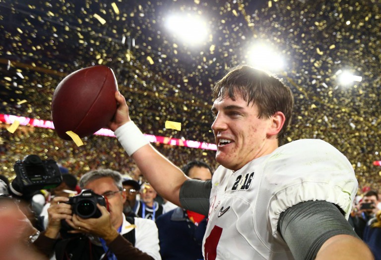 Jan 11, 2016; Glendale, AZ, USA; Alabama Crimson Tide quarterback Jake Coker (14) celebrates on the field after defeating the Clemson Tigers in the 2016 CFP National Championship at University of Phoenix Stadium. Mandatory Credit: Mark J. Rebilas-USA TODAY Sports