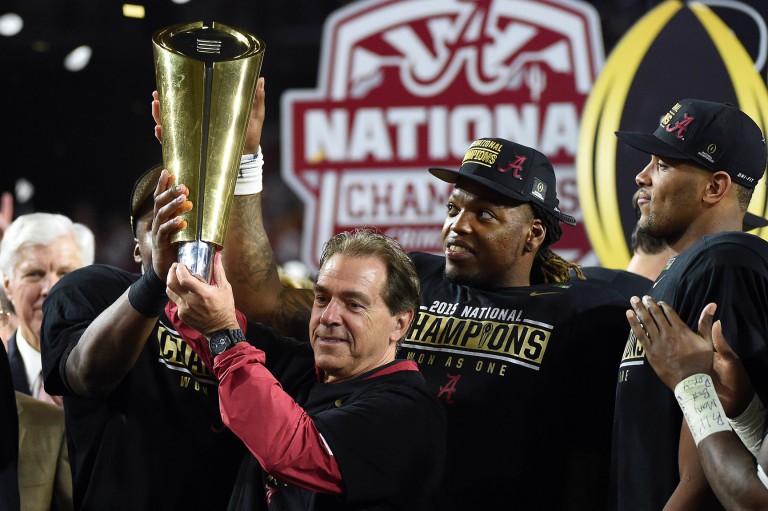 Jan 11, 2016; Glendale, AZ, USA; Alabama Crimson Tide head coach Nick Saban and running back Derrick Henry (2) celebrate with the 2016 CFP National Championship trophy after beating the Clemson Tigers at University of Phoenix Stadium. Mandatory Credit: Kirby Lee-USA TODAY Sports