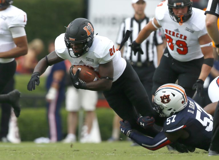 Sep 16, 2017; Auburn, AL, USA; Auburn Tigers linebacker Deshaun Davis (57) tackles Mercer Bears running back Tee Mitchell (28) during the third quarter at Jordan-Hare Stadium. Mandatory Credit: John Reed-USA TODAY Sports