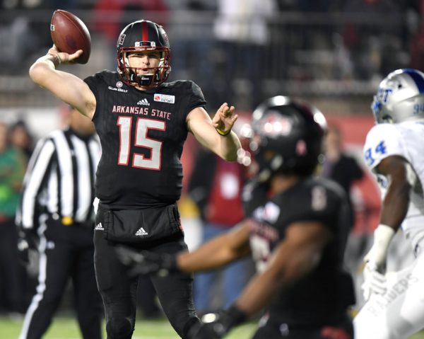 Dec 16, 2017; Montgomery, AL, USA; Arkansas State Red Wolves quarterback Justice Hansen (15) looks to throw the ball to running back Warren Wand (6) in the fourth quarter against the Middle Tennessee Blue Raiders in the 2017 Camellia Bowl at Cramton Bowl. Mandatory Credit: RVR Photos-USA TODAY Sports